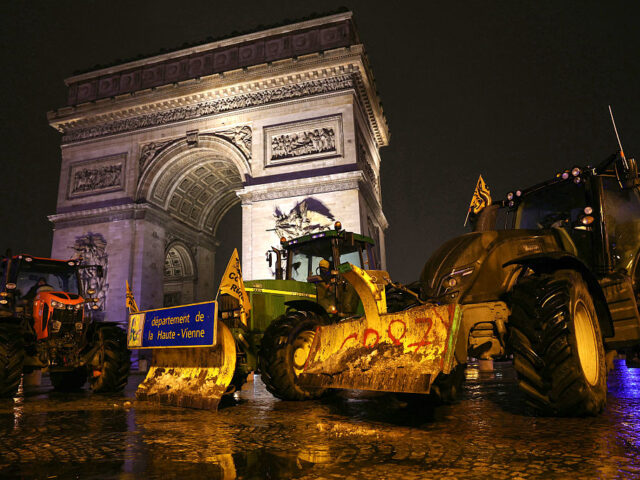 FRANCE-AGRICULTURE-POLITICS-PROTEST Tractors are parked in front of the Arc de Triomphe during a demonstration of French agric