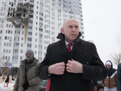 Defence Secretary John Healey views damage caused by a Russian missile strike on a residen