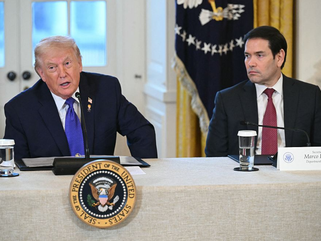 US President Donald Trump speaks as US Secretary of State Marco Rubio (R) looks on during