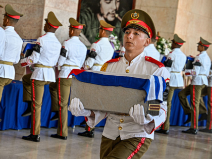 A Cuban guard of the Ceremonial Battalion carry the urns with the remains of the 32 Cuban