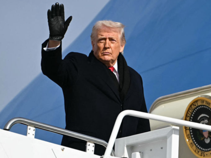 US President Donald Trump waves as he boards Air Force One at Joint Base Andrews, Maryland