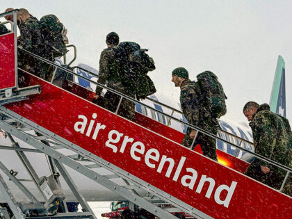 Military personnel from the German armed Forces Bundeswehr board the Icelandair flight lea