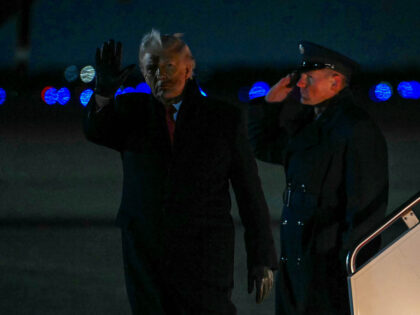 TOPSHOT - US President Donald Trump steps off Air Force One at Joint Base Andrews in Maryl