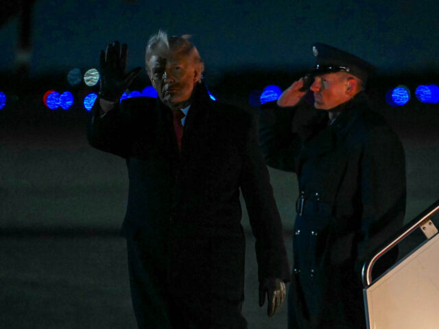 TOPSHOT - US President Donald Trump steps off Air Force One at Joint Base Andrews in Maryl