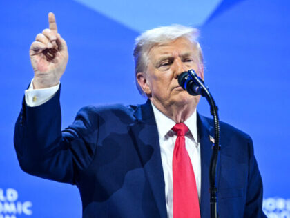 US President Donald Trump gestures as he delivers a special address during the World Econo