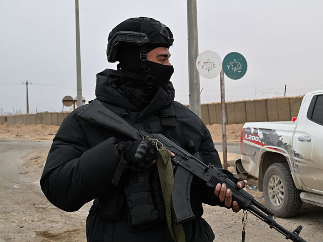 GettyImages-2256968037 DEIR EZ-ZOR, SYRIA - JANUARY 22: Security forces of Syria's Interior Ministry guard the al