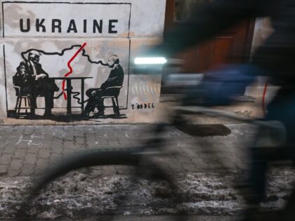 KRAKOW, POLAND JANUARY 22:A mural titled 'Divided by Oligarchy' by anonymous Norwegian str