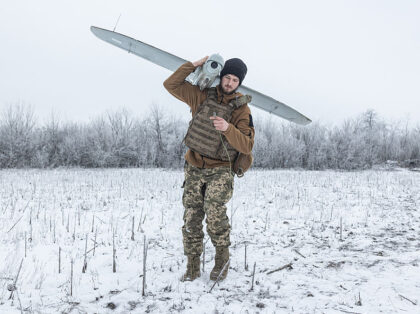 DONETSK OBLAST, UKRAINE - JANUARY 22: A Ukrainian soldier carries a reconnaissance drone t