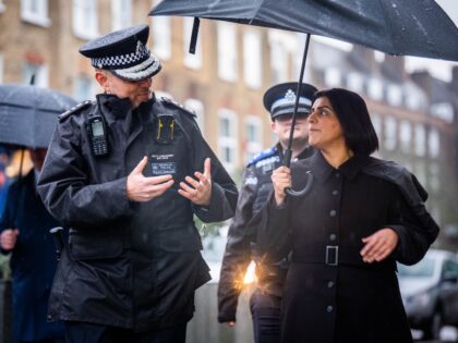 Home Secretary Shabana Mahmood speaks with police officers during a walkabout in Lambeth,