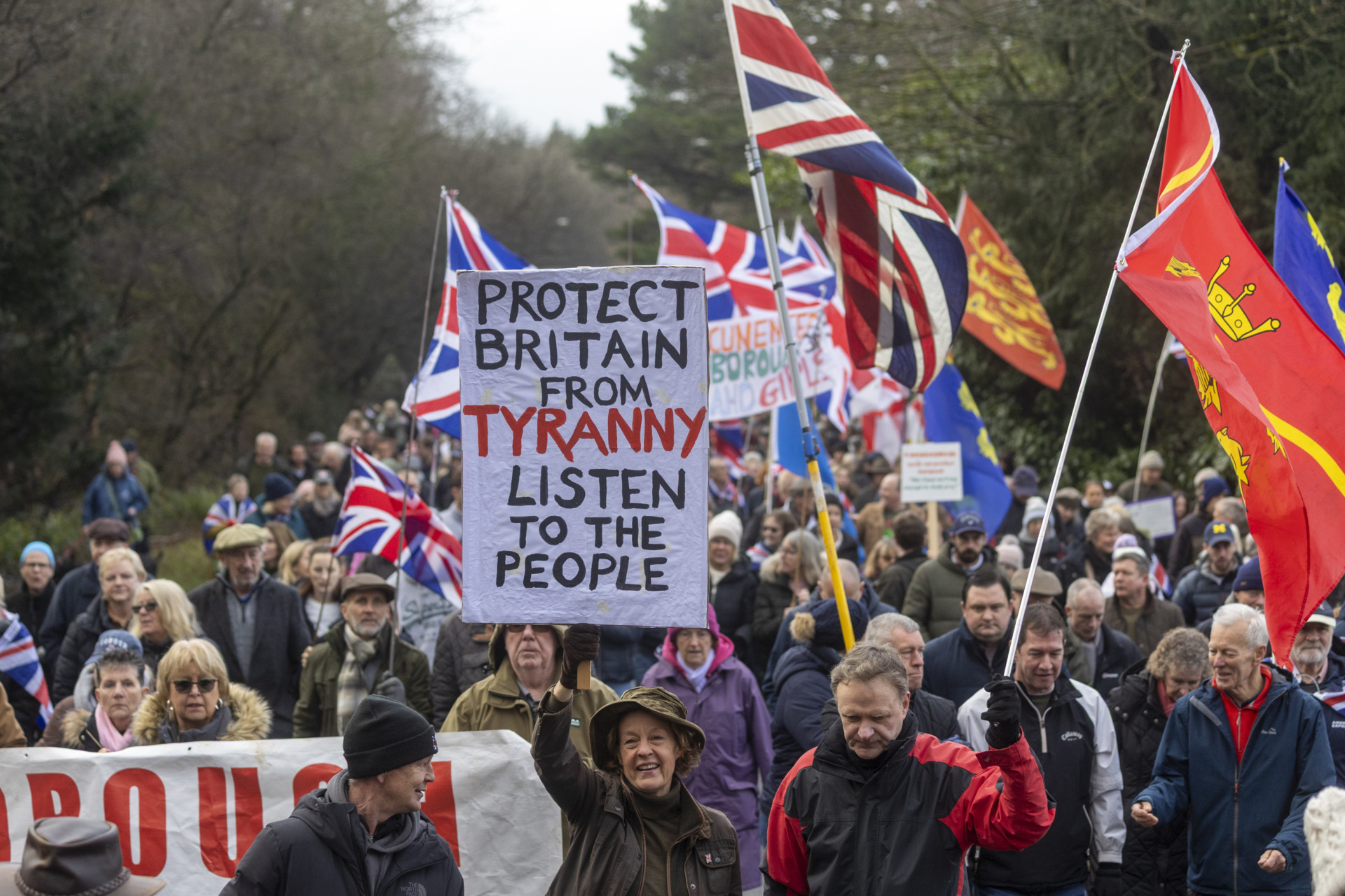 CROWBOROUGH, UNITED KINGDOM - JANUARY 25: Protesters march from Crowborough Training Camp, a former military site, in Crowborough, United Kingdom, on January 25, 2026, during a protest calling for the barracks not to be used to house asylum seekers. The the first 27 illegal migrants had been moved into the Crowborough military barracks in East Sussex, which will eventually house more than 500 illegal migrants. (Photo by Marcin Nowak/Anadolu via Getty Images)