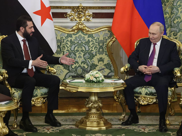MOSCOW, RUSSIA - JANUARY 28: Russian President Vladimir Putin (R) listens to Syrian Presid