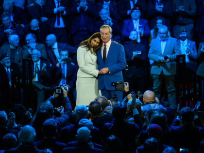 LONDON, ENGLAND - JANUARY 26: Reform UK leader Nigel Farage embraces former Conservative H