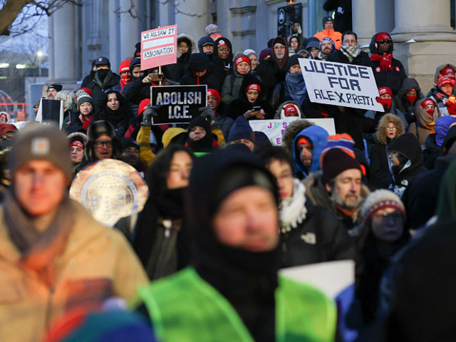 GettyImages-2258345988 People attend a vigil for Alex Pretti, a 37-year-old nurse who was fatally shot by immigra