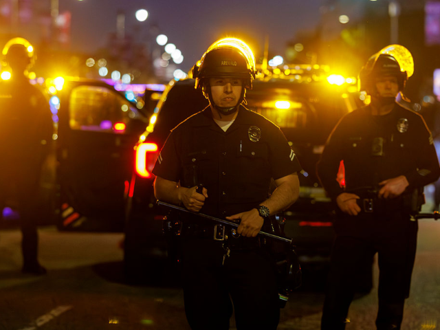 GettyImages-2258633082 LOS ANGELES, CA - JANUARY 30, 2026: LAPD officers stand in tactical formation to keep prot