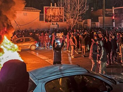 Iranians gather while blocking a street during a protest in Tehran, Iran on January 9, 202