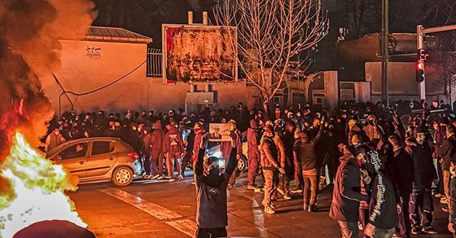 Iranians gather while blocking a street during a protest in Tehran, Iran on January 9, 2026. The nationwide protests started in Tehran's Grand Bazaar against the failing economic policies in late December, which spread to universities and other cities, and included economic slogans, to political and anti-government ones. (Photo by MAHSA / Middle East Images / AFP via Getty Images)