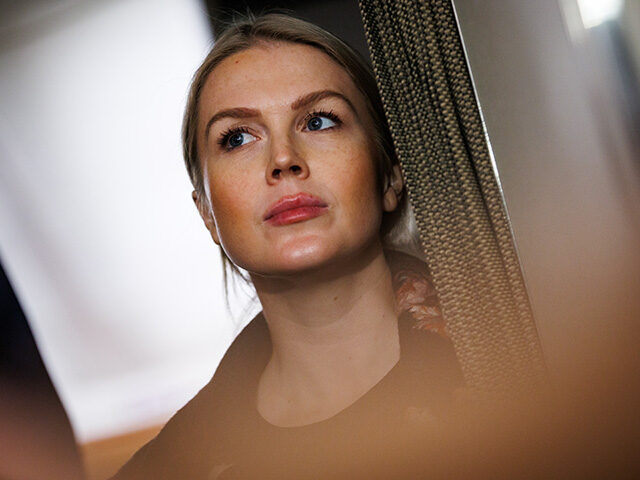GettyImages2255276774 White House Press Secretary Karoline Leavitt listens as U.S. President Donald Trump takes