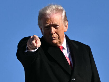 US President Donald Trump gestures as he boards Air Force One at Joint Base Andrews, Maryl
