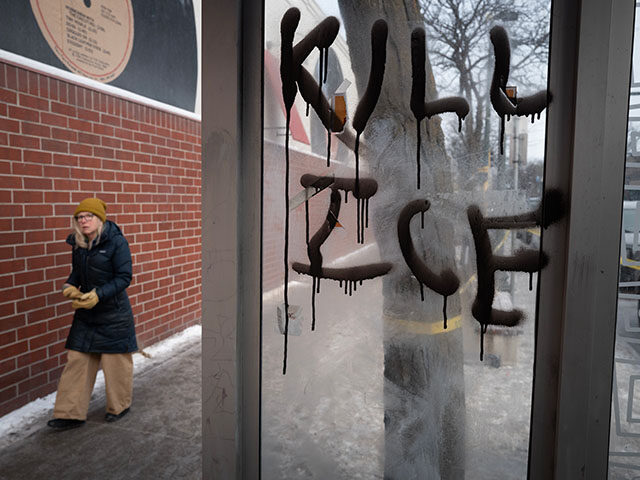GettyImages2258128287 Graffiti is scrawled on a bus stop near a memorial to Alex Pretti on January 25, 2026 in M