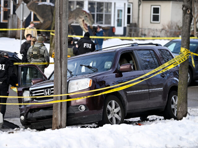ICE Officer Shooting Members of law enforcement work the scene following a suspected shooting by an ICE agent d