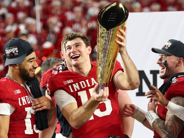 MIAMI GARDENS, FLORIDA - JANUARY 19: Fernando Mendoza #15 of the Indiana Hoosiers raises t