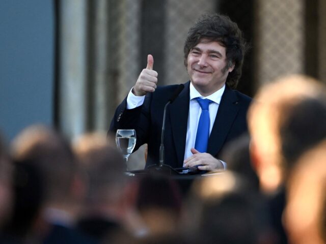 Argentina's President Javier Milei gives a thumb-ups during the official presentation of a