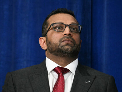 FBI Director Kash Patel looks on as President Donald Trump speaks to the press following U
