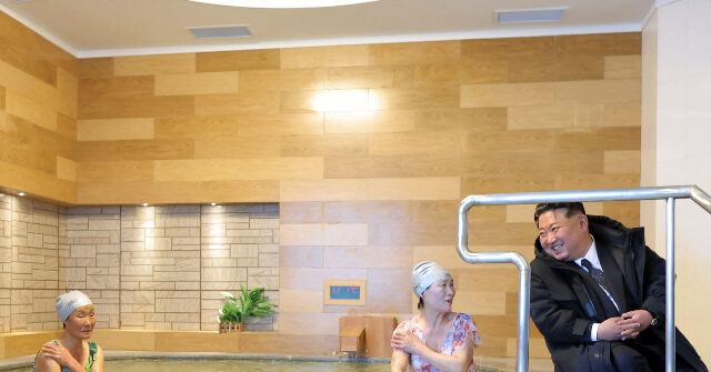 North Korea: Kim Jong-un, in Massive Coat, Chats Up Visitors in Swimsuits at Hot Spring Resort