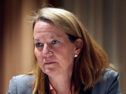 FILE - Arizona Attorney General Kris Mayes pauses during an interview with The Associated