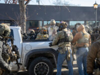Community Members’ with Rifles Stand Guard in Minneapolis Where Armed Man Was Shot