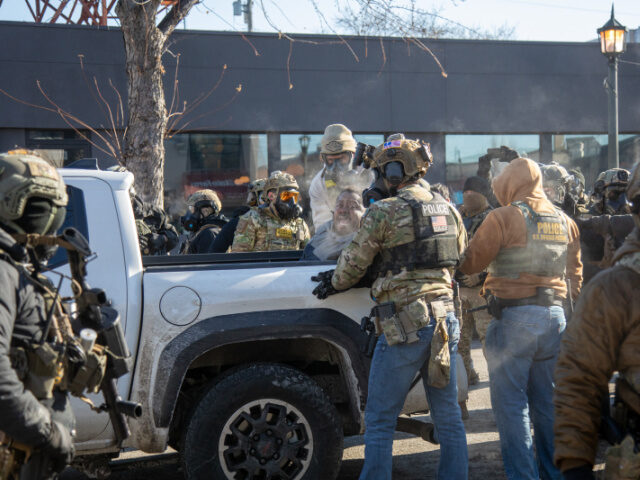 Man shot Minneapolis Protesters clash with law enforcement after a federal agent shot and killed a man on Jan.
