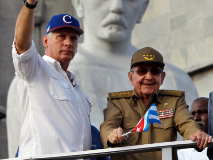President of Cuba Miguel Díaz-Canel (L) greets Cubans along with the current first secret