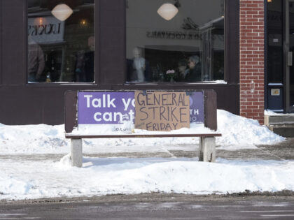 A sign promoting a general strike in opposition to the ongoing Immigration and Customs Enf