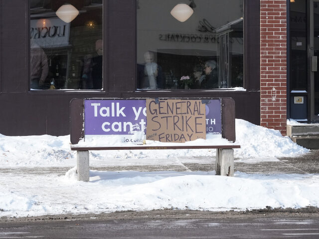 A sign promoting a general strike in opposition to the ongoing Immigration and Customs Enf