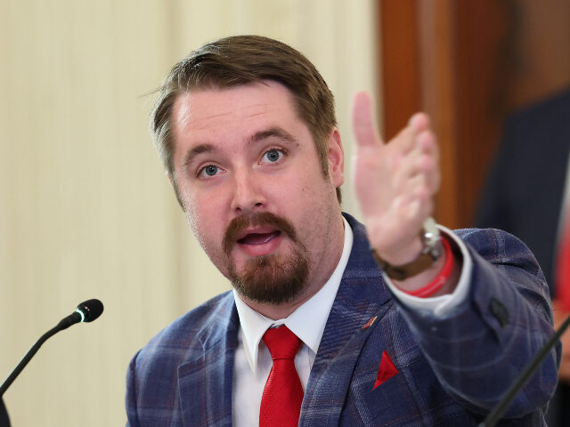 Conservative influencer Nick Sortor gestures as he speaks during a roundtable discussion i