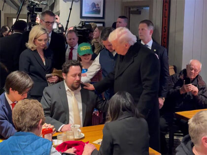 Patron in Machine Shed restaurant in Iowa prays over President Trump