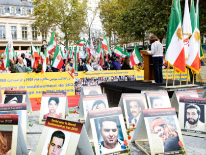 A large gathering of NCRI and MEK supporters is seen honoring the martyrs of Iran's 2