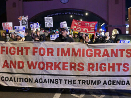 Demonstrators and community members gather in Chicago's Little Village neighborhood o