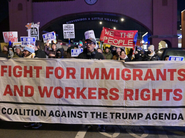 Demonstrators and community members gather in Chicago's Little Village neighborhood o