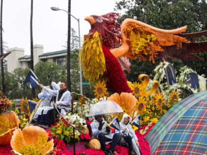 A floral float takes to the street in the rain during the 137th Rose Parade on January 1,