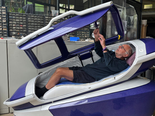 FILE - Philip Nitschke enters a 'suicide pod' known as 'The Sarco' in