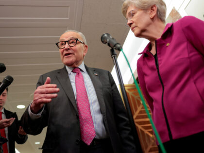 U.S. Senate Minority Leader Chuck Schumer (D-NY) (L) and U.S. Senator Elizabeth Warren (D-