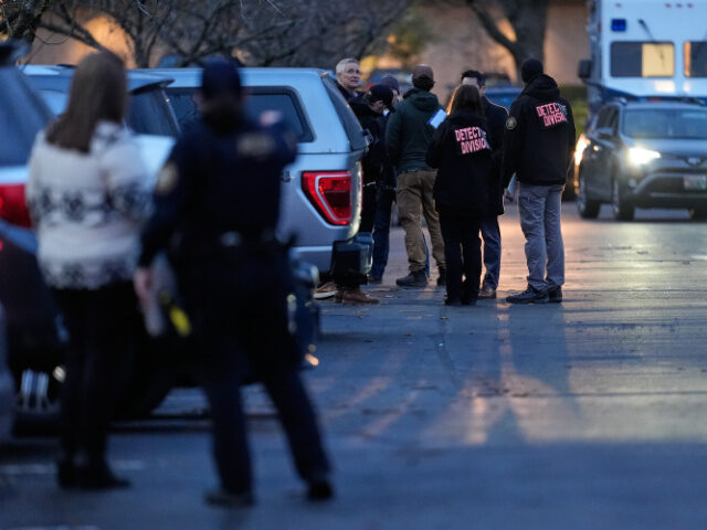 Law enforcement officials work the scene following reports that federal immigration office