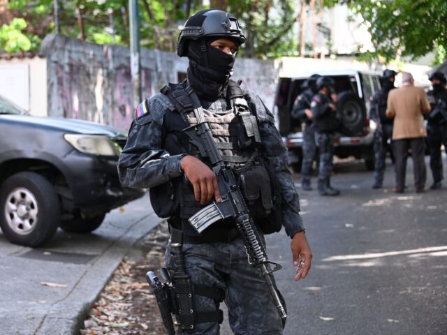 Members of Venezuela Intelligence Services (SEBIN) stand guard outside the Venezuelan form