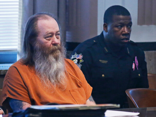 FILE - In this Oct. 18, 2017 file photo, William Lewis Reece, left, waits for a hearing to
