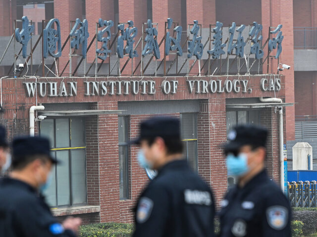 Wuhan Institute of Virology Security personnel stand guard outside the Wuhan Institute of Virology in Wuhan as members