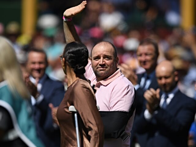 SYDNEY, AUSTRALIA - JANUARY 04: Ahmed al-Ahmed, hero of Bondi waves to the spectators befo