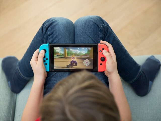 boy playing Nintendo switch