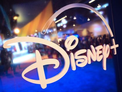 Fans are reflected in Disney+ logo during the Walt Disney D23 Expo in Anaheim, California