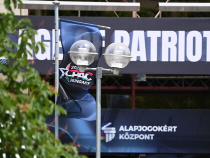 A flag and signs are seen at the Budapest Congress Center during an offshoot meeting of th